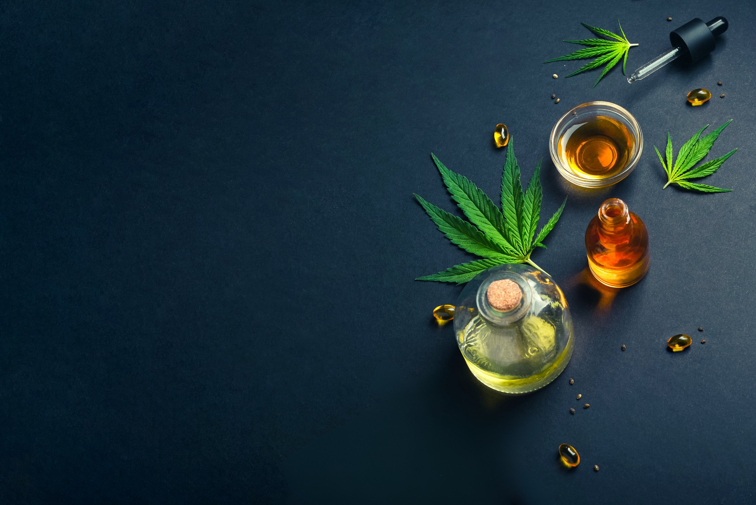 Medical CBD Oil, Tincture on Black Trendy Background 