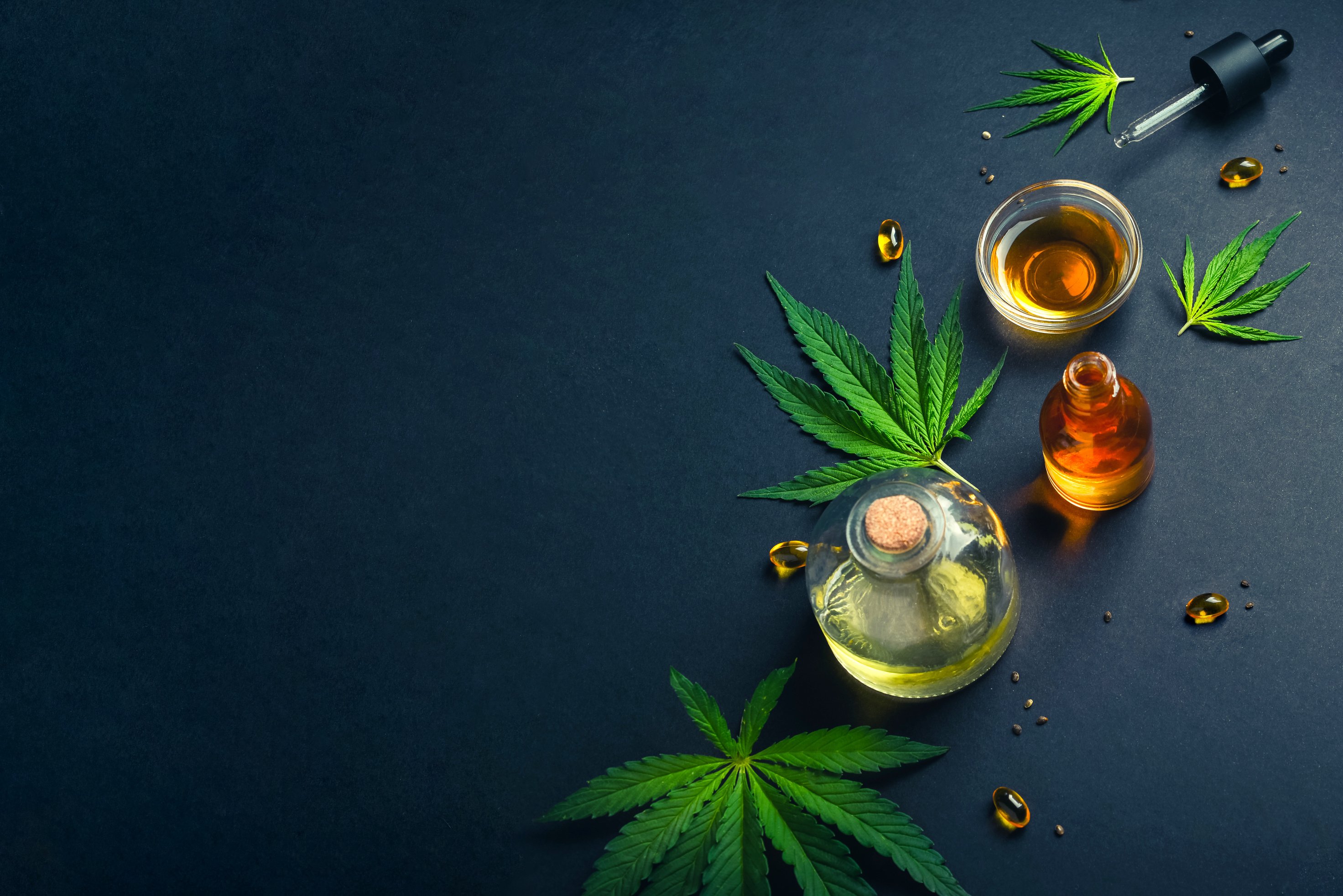 Medical CBD Oil, Tincture on Black Trendy Background 